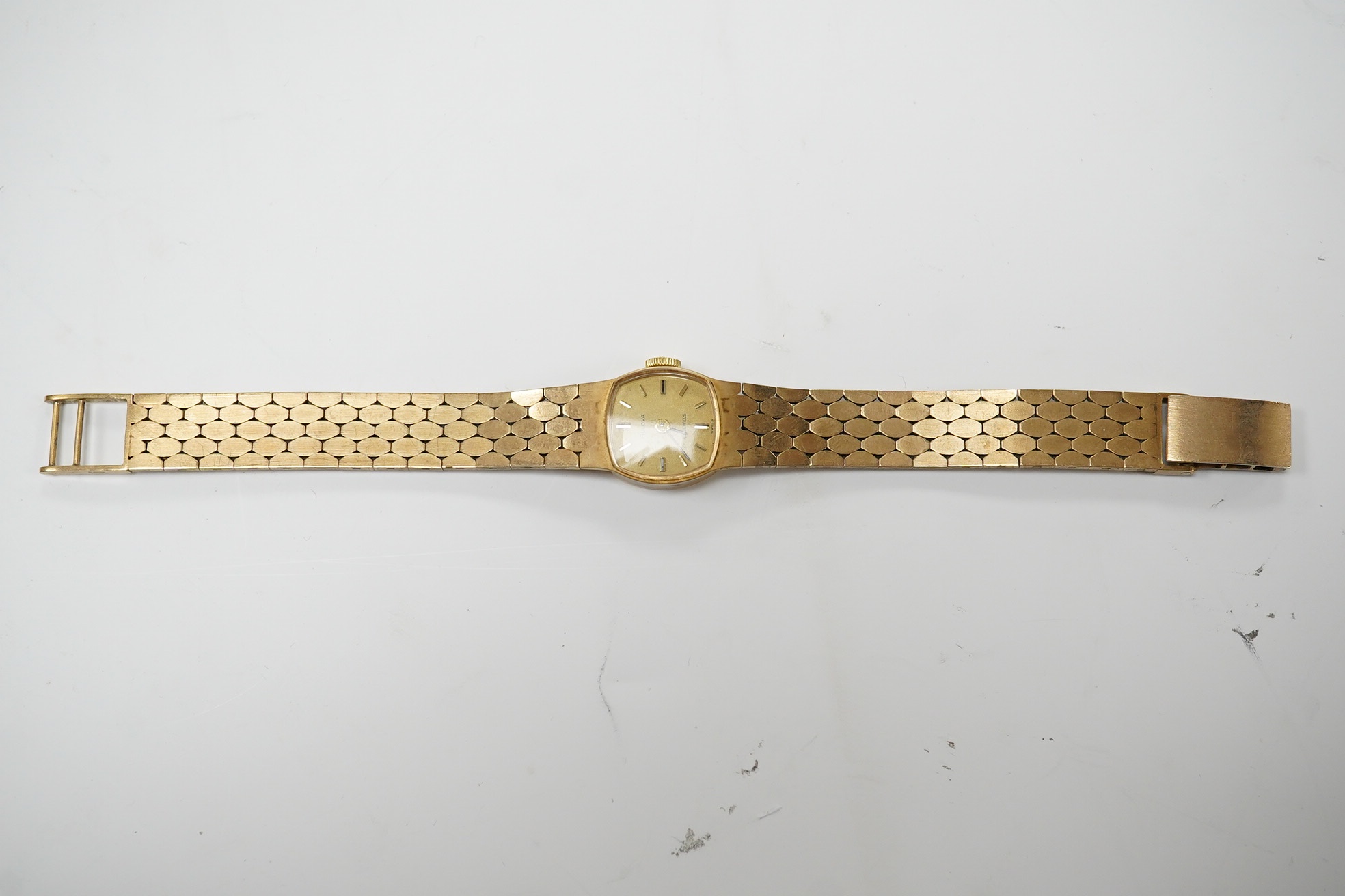 A lady's early 1970's 9ct Bulova manual wind bracelet wrist watch, overall length 15.6cm, gross weight 23 grams. Condition - fair